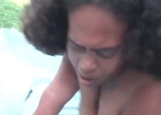 Curly-haired beauty blows a nasty dog